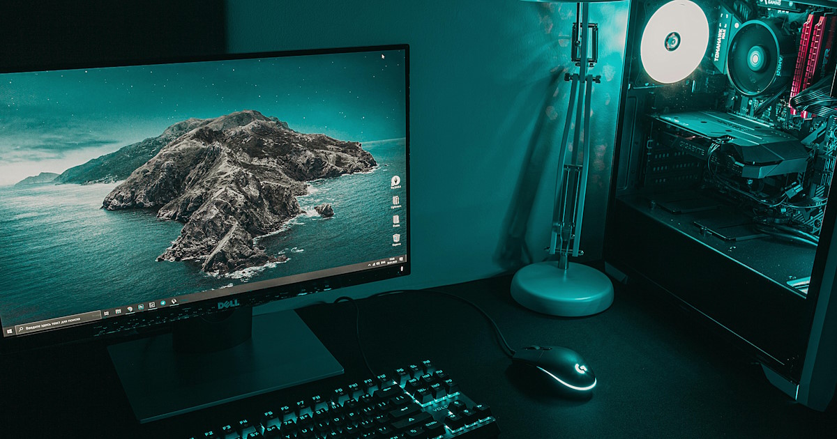 Clean computer workstation with a beach island wallpaper symbolizing modern Hawaii web design