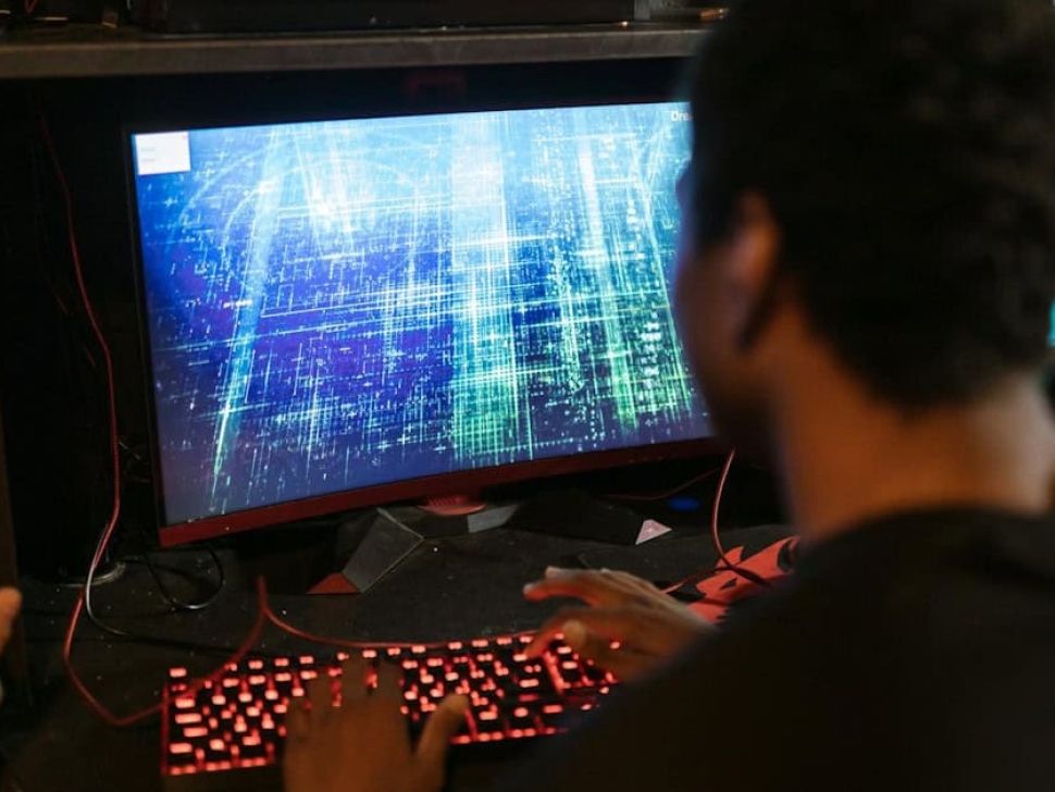 Person typing on laptop choosing a domain name for their new business website.