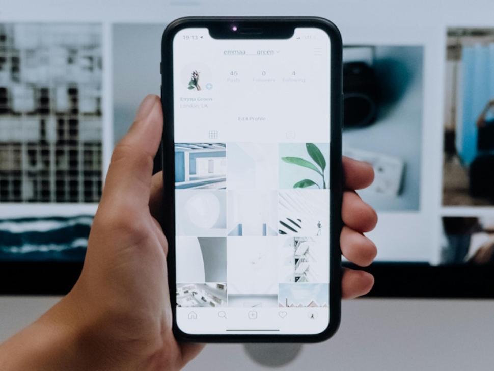 Mobile phone showing a clean modern layout representing mobile friendly website design