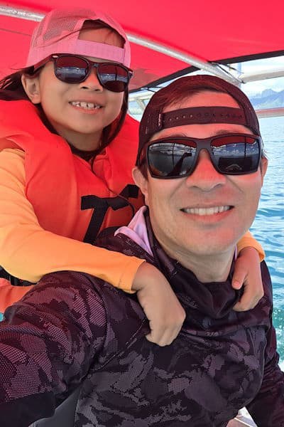 Local Oahu web design duo enjoying the ocean water, representing Clean Design Launch web design and digital marketing services.